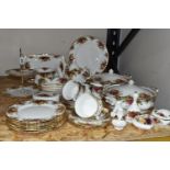 A QUANTITY OF ROYAL ALBERT DINNERWARE, comprising two covered tureens, six dinner plates, six side