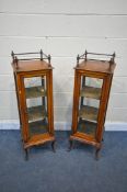 A PAIR OF LATE 19TH / EARLY 20TH CENTURY WALNUT CENTRE GLAZED DISPLAY CABINETS, with a gallery