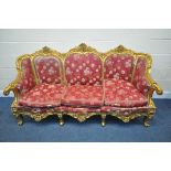 A LOUIS XV FRENCH STYLE GILTWOOD SOFA, with a foliate carved frame, length 204cm x depth 78cm x