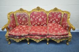 A LOUIS XV FRENCH STYLE GILTWOOD SOFA, with a foliate carved frame, length 204cm x depth 78cm x
