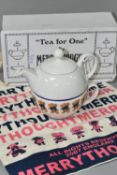 A BOXED ARTHUR WOOD 'TEA FOR ONE' TEAPOT, by Merrythought, together with a small linen '