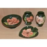 FOUR PIECES OF MOORCROFT POTTERY 'CORAL HIBISCUS' GIFTWARES, comprising two vases, heights 10.5cm