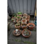 A SELECTION OF SMALL TERRACOTTA PLANT POTS, of various sizes (15+)
