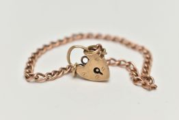 A 9CT GOLD CURB LINK BRACELET, fitted with a heart padlock clasp, clasp and chain hallmarked 9ct