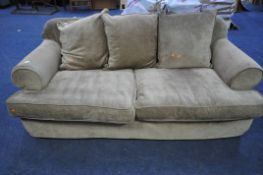 A BROWN UPHOLSTERED TWO SEATER SOFA BED