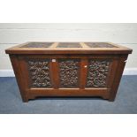 AN EARLY 20TH CENTURY OAK COFFER, decorated with nine foliate carved panels, width 122cm x depth