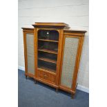 A REPRODUCTION KINGWOOD AND INLAID FRENCH TRIPLE DOOR CABINET, the outer doors with brass mesh