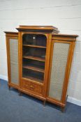 A REPRODUCTION KINGWOOD AND INLAID FRENCH TRIPLE DOOR CABINET, the outer doors with brass mesh