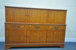 A YEW WOOD CABINET, with an arrangement of drawer’s cupboard doors, width 164cm x depth 45cm x