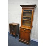 AN STAINED BEECH GLAZED SINGLE DOOR BOOKCASE, over a base with a single drawer and cupboard door,
