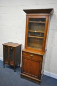 AN STAINED BEECH GLAZED SINGLE DOOR BOOKCASE, over a base with a single drawer and cupboard door,