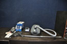 A MIELE CLASSIC C1 POWERLINE VACUUM CLEANER with accessories and spare bags and filters