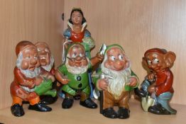 A VINTAGE TERRACOTTA PART SET OF SNOW WHITE AND SIX OF THE DWARFS, hollow slip cast painted