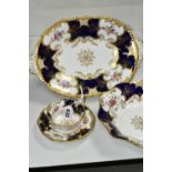 TWO COALPORT DISHES, together with a cup and saucer, cobalt blue panels, Y2665 pattern inside cup,