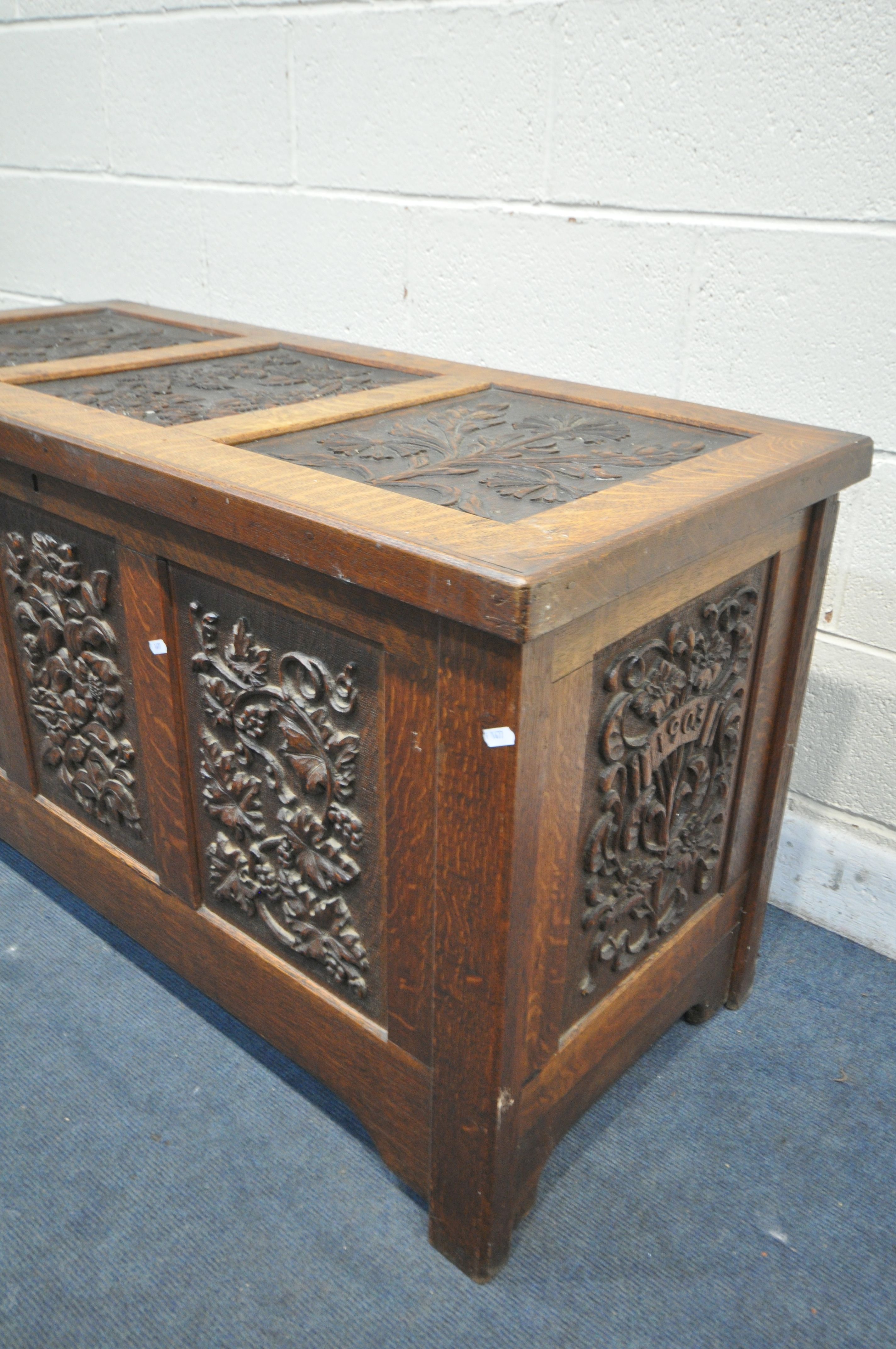 AN EARLY 20TH CENTURY OAK COFFER, decorated with nine foliate carved panels, width 122cm x depth - Image 3 of 6