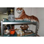 A LARGE TIGER SOFT TOY, brass oil lamp, basket of shells, framed prints, W.H. Goss Crested ware, a