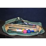 A JAQUES OF LONDON CROQUET SET IN CANVAS BAG with 4 mallets, eight coloured balls, 11 hoops and