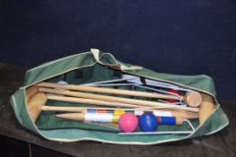 A JAQUES OF LONDON CROQUET SET IN CANVAS BAG with 4 mallets, eight coloured balls, 11 hoops and