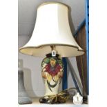A MOORCROFT TABLE LAMP, Anna Lily pattern on a cream ground, original shade, height 36cm to top of