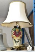 A MOORCROFT TABLE LAMP, Anna Lily pattern on a cream ground, original shade, height 36cm to top of