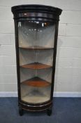 A 19TH CENTURY MAHOGANY BOW FRONT GLAZED CORNER DISPLAY CABINET, with three later shelves, on scroll