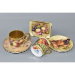 A COFFEE CAN AND SAUCER HAND PAINTED BY ROYAL WORCESTER ARTIST BRYAN COX, painted with apples,