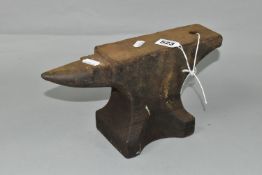 A SMALL CAST IRON ANVIL, height 15.5cm x length 28.5cm approx.