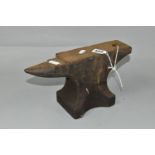 A SMALL CAST IRON ANVIL, height 15.5cm x length 28.5cm approx.