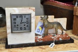 A FRENCH ART DECO MANTEL CLOCK, the geometric three coloured marble case surmounted by a cast
