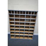 A VINTAGE PINE POST OFFICE LETTER SORTING SHELVES/UNIT, making up a total of 45 divisions, width