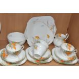 A NINETEEN PIECE SHELLEY 'ORANGE WISTERIA' PATTERN PART TEA SET, with printed and tinted foliate