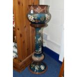 A LANGLEY STONEWARE JARDINIERE ON A PEDESTAL DECORATED IN TONES OF TEAL AND BROWN, decorated with