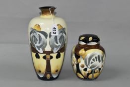 TWO OLD TUPTON WARE VASES, decorated in the style of Charles Rennie Mackintosh, with stylised