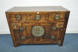 A 19TH CENTURY CHINESE HARDWOOD SIDEBOARD, with five drawers surrounding double cupboard doors