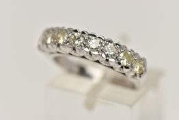 AN 18CT GOLD DIAMOND RING, designed as a row of eight round brilliant cut diamonds, total