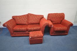 A RED UPHOLSTERED THREE PIECE LOUNGE SUITE, comprising a two seater settee, length 191cm, armchair