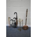 A 19TH CENTURY SQUARE BRASS STICK STAND, with contents including five umbrellas and a stick, along