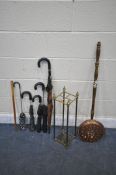 A 19TH CENTURY SQUARE BRASS STICK STAND, with contents including five umbrellas and a stick, along