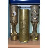 A PAIR OF FLUTED TRENCH ART VASES, decorated with a floral design, together with a single trench art