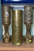 A PAIR OF FLUTED TRENCH ART VASES, decorated with a floral design, together with a single trench art