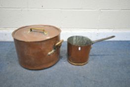 A LARGE COPPER TWO HANDLED BOILING POT WITH LID together with a smaller tall single handled sauce