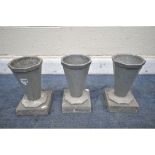 THREE FRENCH ART DECO METAL CEMETERY POTS, of an octagonal tapered form, on a slate base, each