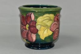 A MOORCROFT POTTERY PLANTER, tube lined with a pink Clematis pattern on a graduated green to
