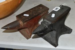 TWO SMALL CAST IRON ANVILS, red painted example height 10cm x length 25cm, the black painted example