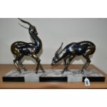 AN ART DECO SCULPTURE OF A PAIR OF GAZELLES, in bronzed finish, on a three coloured marble plinth,