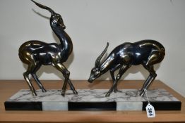 AN ART DECO SCULPTURE OF A PAIR OF GAZELLES, in bronzed finish, on a three coloured marble plinth,