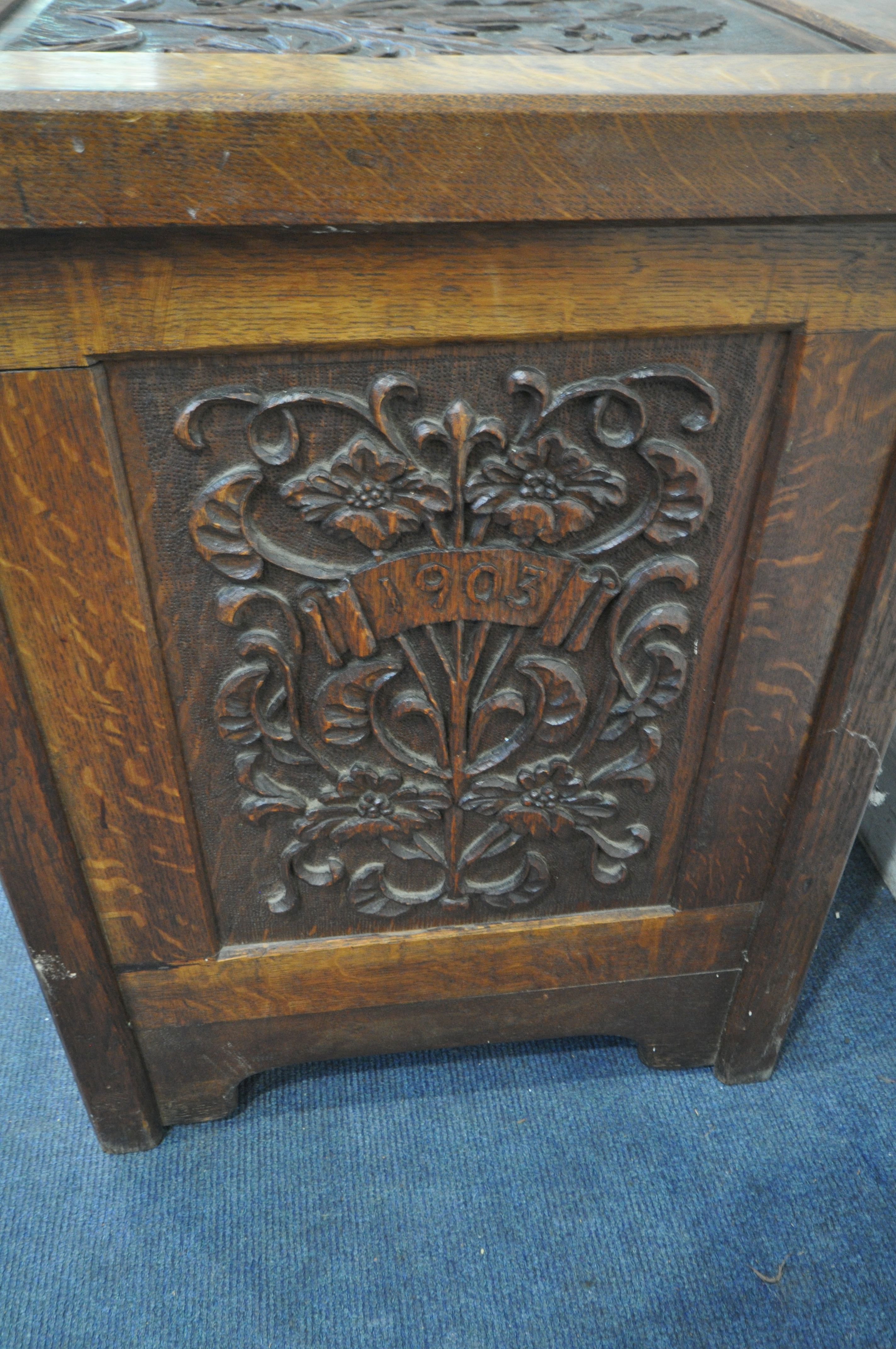 AN EARLY 20TH CENTURY OAK COFFER, decorated with nine foliate carved panels, width 122cm x depth - Image 4 of 6