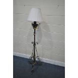 AN ARTS AND CRAFTS WROUGHT IRON, BRASS AND COPPER CONVERTED OIL LAMP, fitted with an electrical