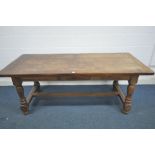 A REPRODUCTION OAK REFECTORY, with a single drawer, on turned and blocked legs. width 200cm x