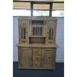 A VICTORIAN PINE CONTINENTAL DRESSER, the top with an arrangement of glazed cupboard doors, over a